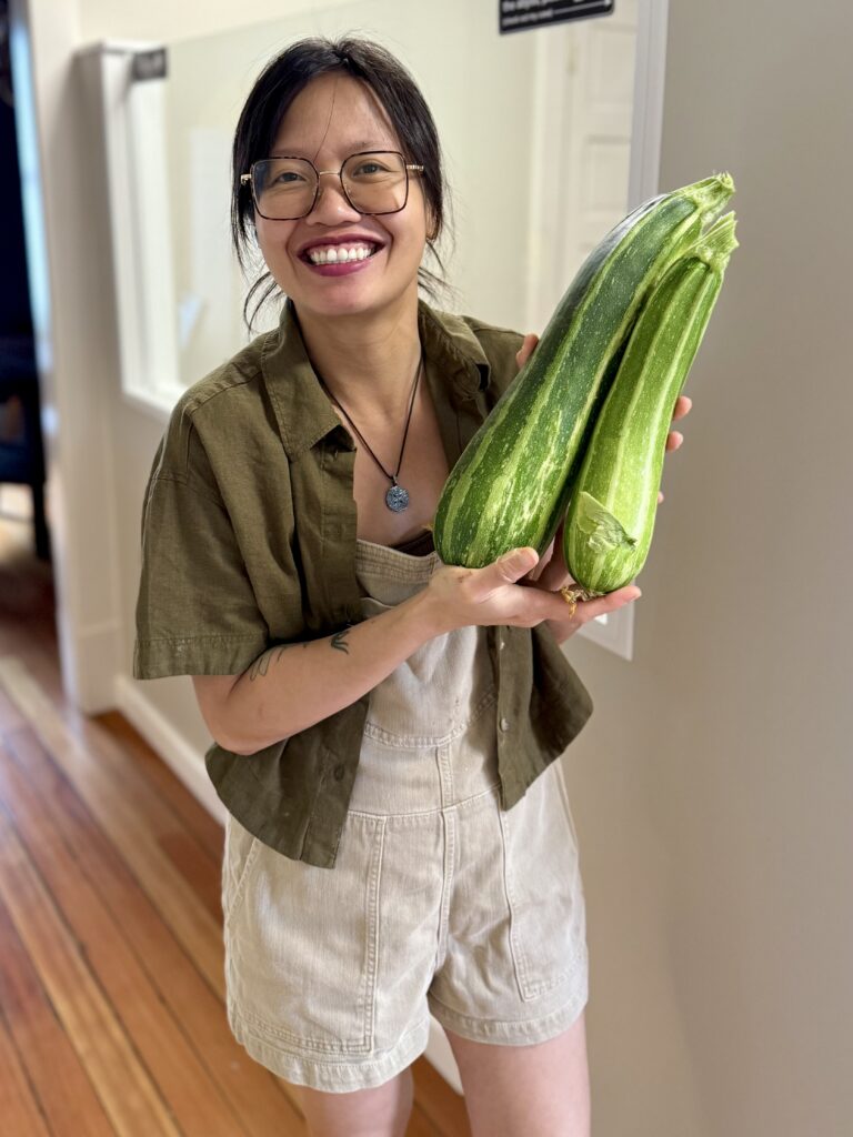 Anh with zucchini Anh with fresh zucchini from the garden.