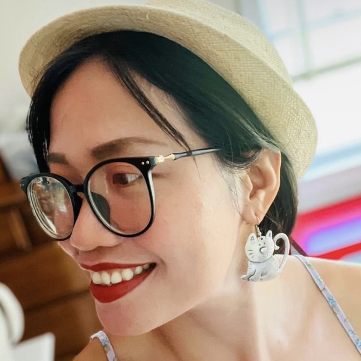 Anh with her hat and cat earring.